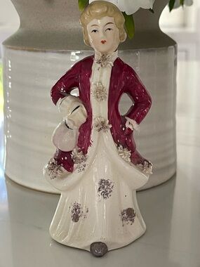 vintage porcelain figurine of a Victorian-style lady